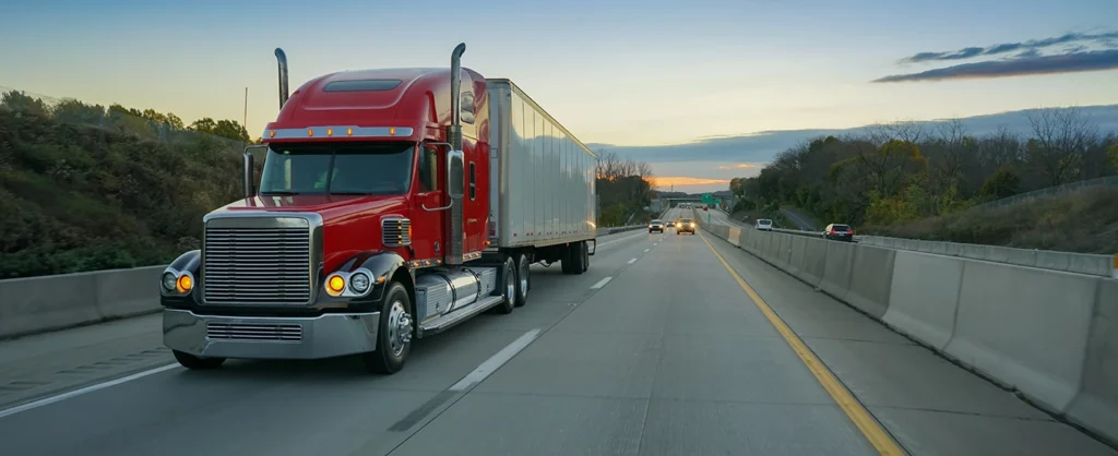 Freight in a Semi Truck at Dusk on the Freeway From 3PL Freight Brokerage