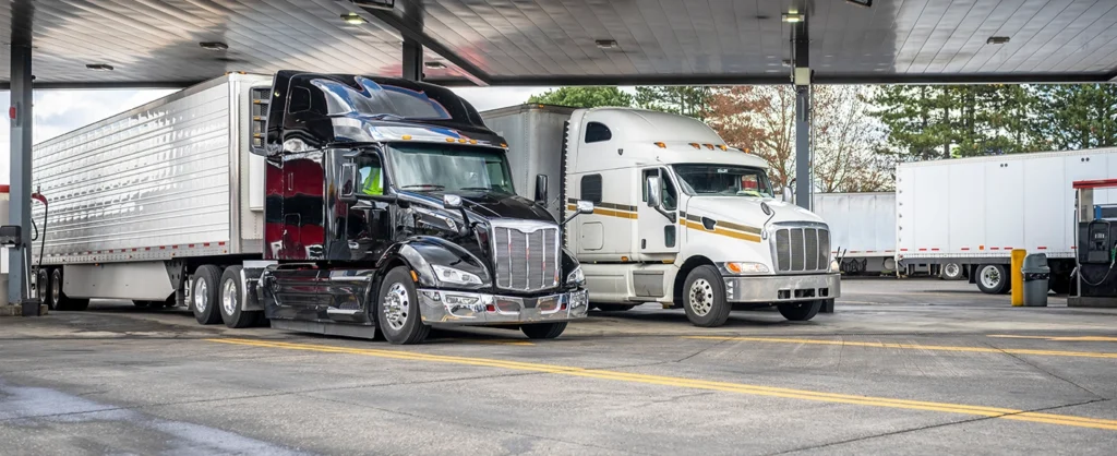 freight carrier of two semi trucks parked