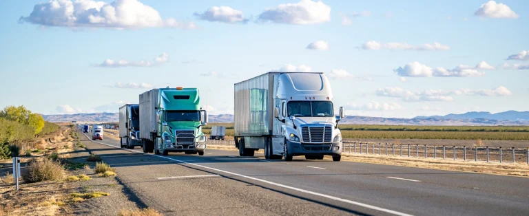 two semi trucks on freeway