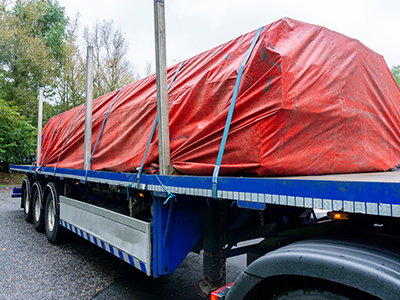 flatbed truck with tarp on cargo