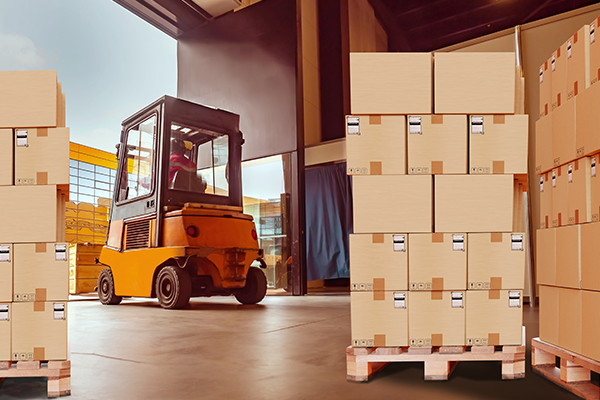 forklift at a shipping dock with boxes